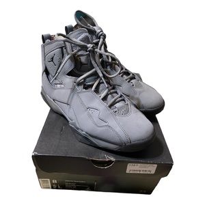 Gray Jordan’s, slightly worn.